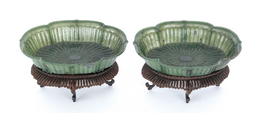 Pair of Chinese spinach-green jade Mughal style bowls, circa 18th/19th century, supported by four pierced scroll feet, 1 3/4 inches high, 7 1/2 inches diameter. Estimate: $3,000-$5,000. Image courtesy of Pook & Pook.